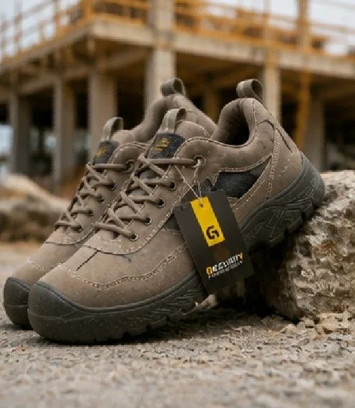 Taupe GUYISA safety shoes shown from an angled front view